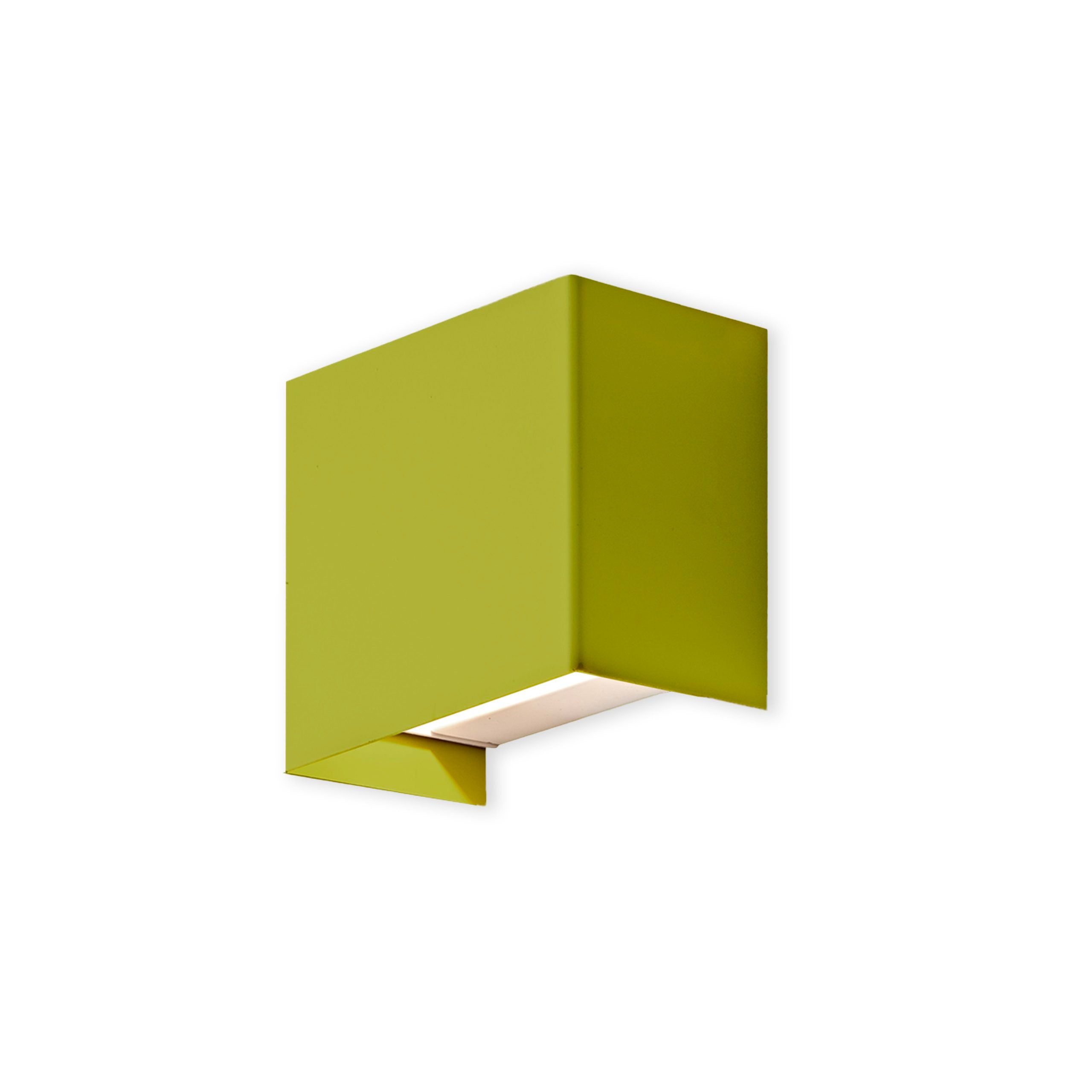 Green wall-mounted light fixture on a white background