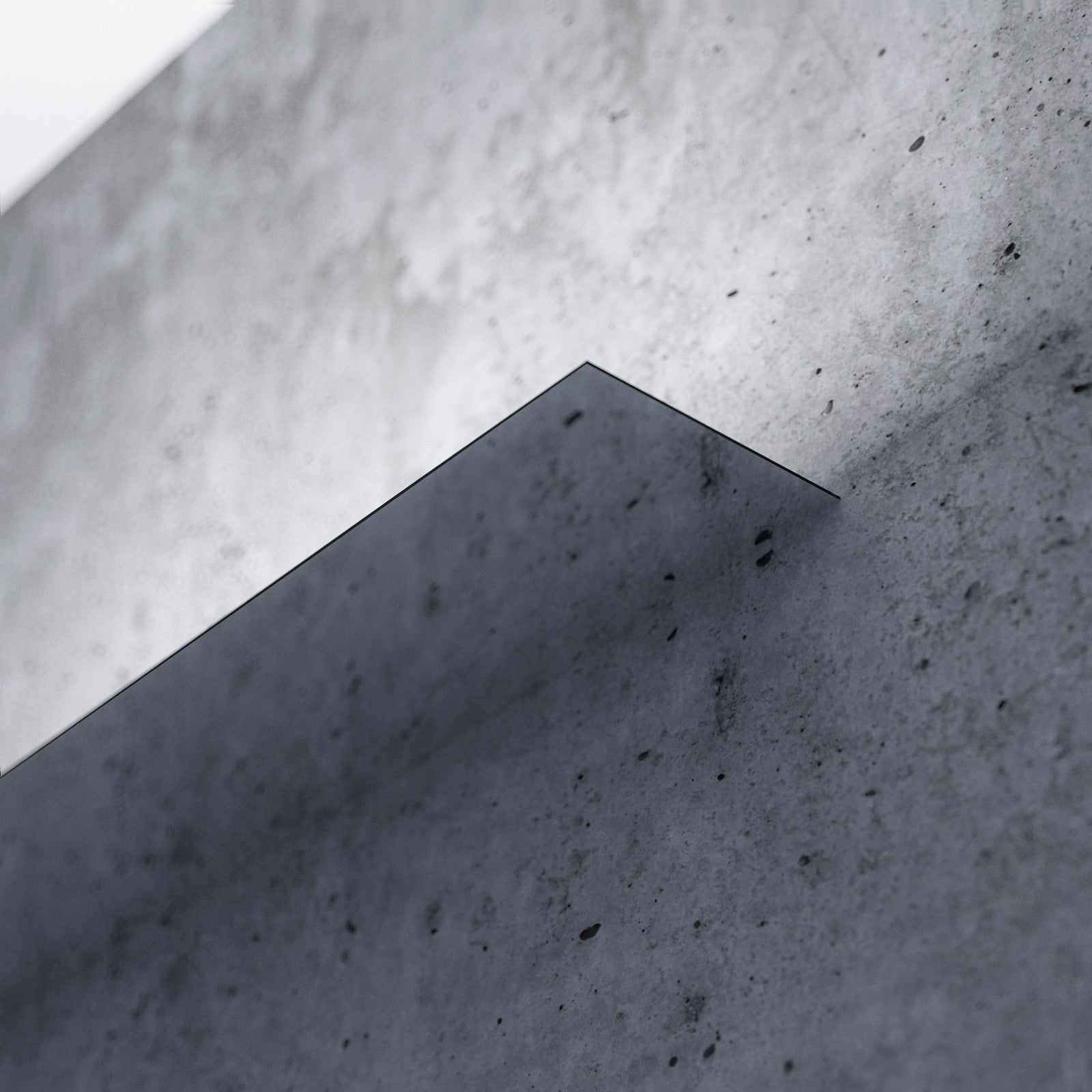 Mirror finished LED wall light on concrete wall