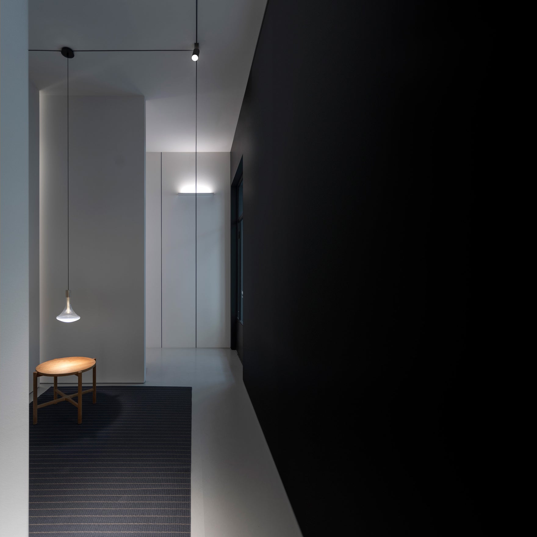 Mirror finished LED wall light on white wall