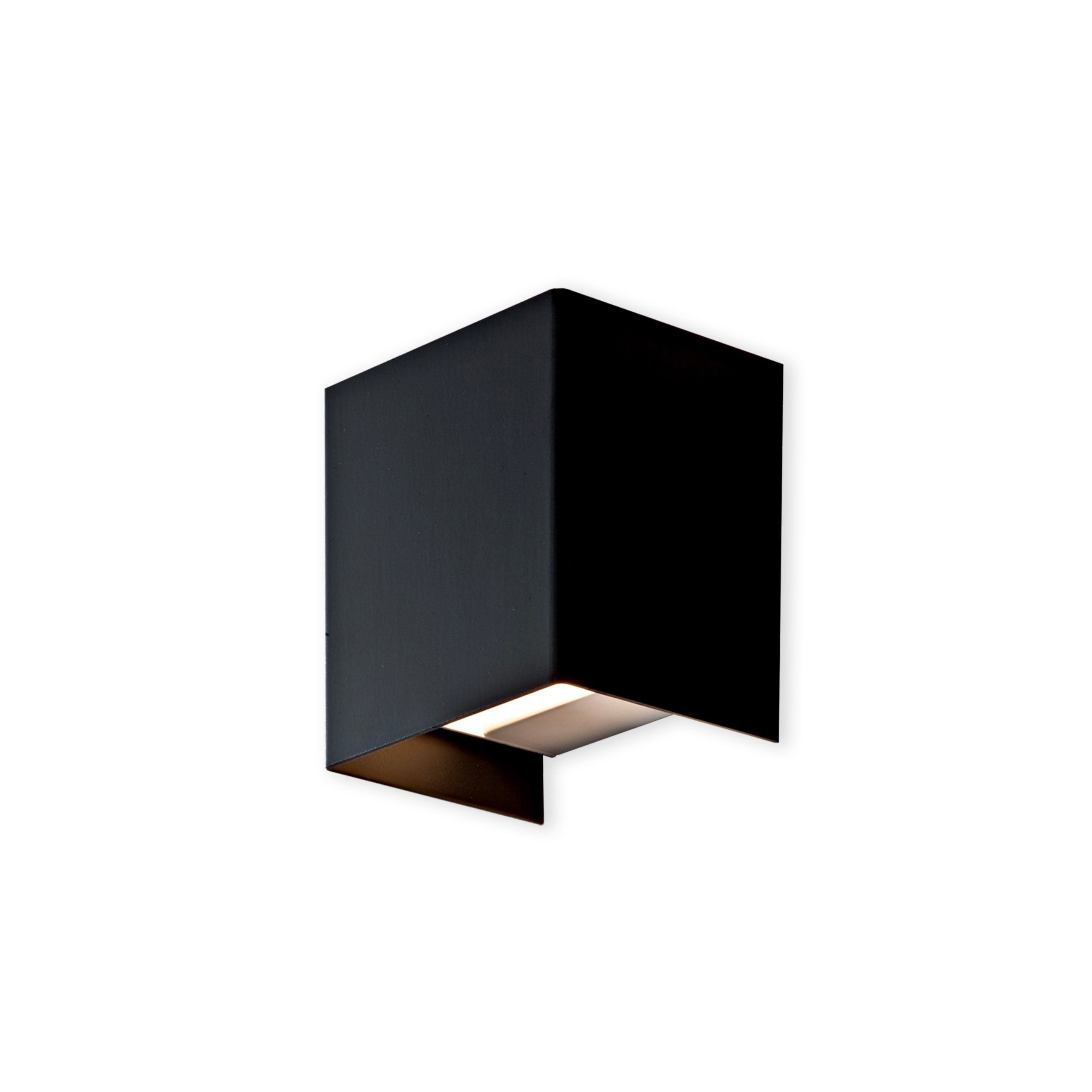 Black wall-mounted light fixture on a white background